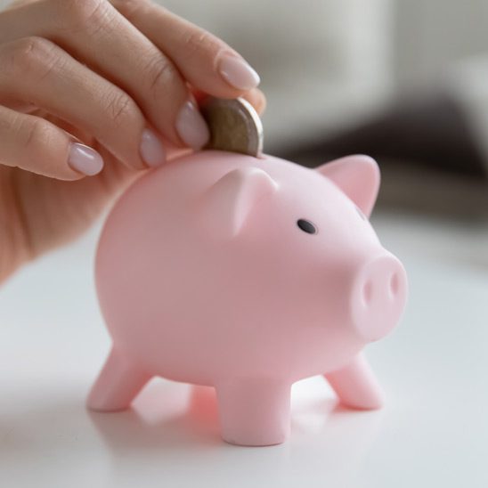 Putting a coin in a piggy bank